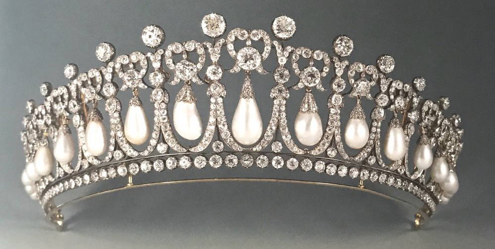 Queen Mary's Lover's Knot Tiara, crafted from natural pearl drops and diamonds in the Queen's collection. This famous tiara has been worn by Queen Mary, Queen Elizabeth II, Princess Diana and most recently, the lovely Kate Middleton, Duchess of Cambridge.